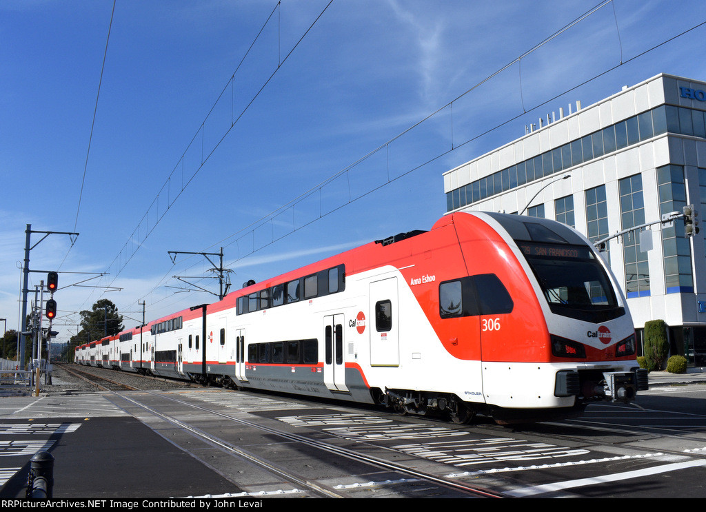 Car # 306 is on the rear of the northbound as the train heads away from the station toward its next stop of Millbrae